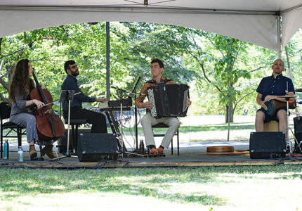 The Ladom Ensemble quartet performs on the grounds of Rideau Hall, under a tent, for Chamberfest.