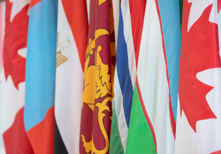 The flags of Mongolia, Egypt, Sri Lanka, The Gambia, and Uzbekistan are side by side.