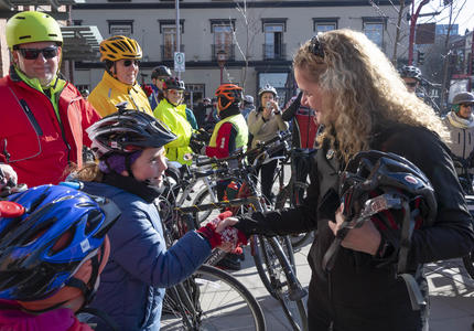 The Governor General shook hands with a cyclist. 