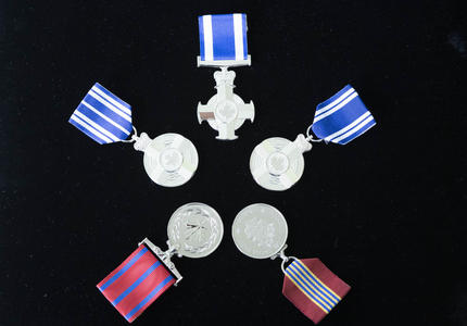 A picture of the various medals presented to recipients at the military-themed honours ceremony