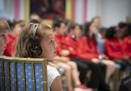A young student listens intently during the question and answer session with the Governor General.