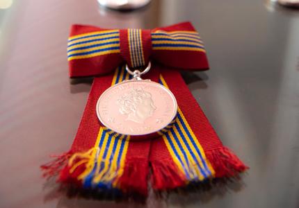 Close-up of the medals being bestowed.