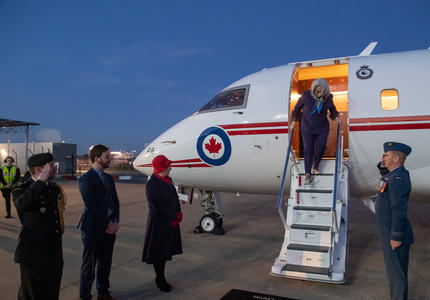 Governor General Mary Simon is descending from a plane.