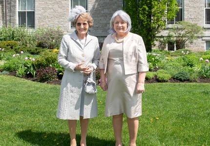 The Governor General is standing next to Her Royal Highness Princess Margriet of the Netherlands outside of Rideau Hall.