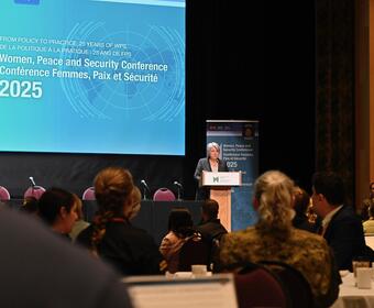 Governor General Mary Simon speaking in a large conference room.