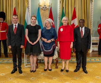 Governor General Marie Simon stands with the new Heads of Mission in the ballroom of Rideau Hall.