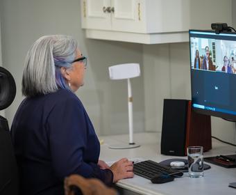 The Governor General participates in a video call on her computer.