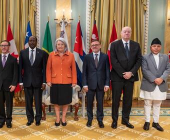 Governor General Mary Simon stands with the new Heads of Mission