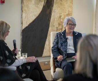 Governor General Mary Simon sitting with a small group of people having a discussion.