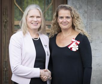 Polar Medal recipient Susan Chatwood shaking hands with Her Excellency The Right Honourable Julie Payette, Governor General of Canada
