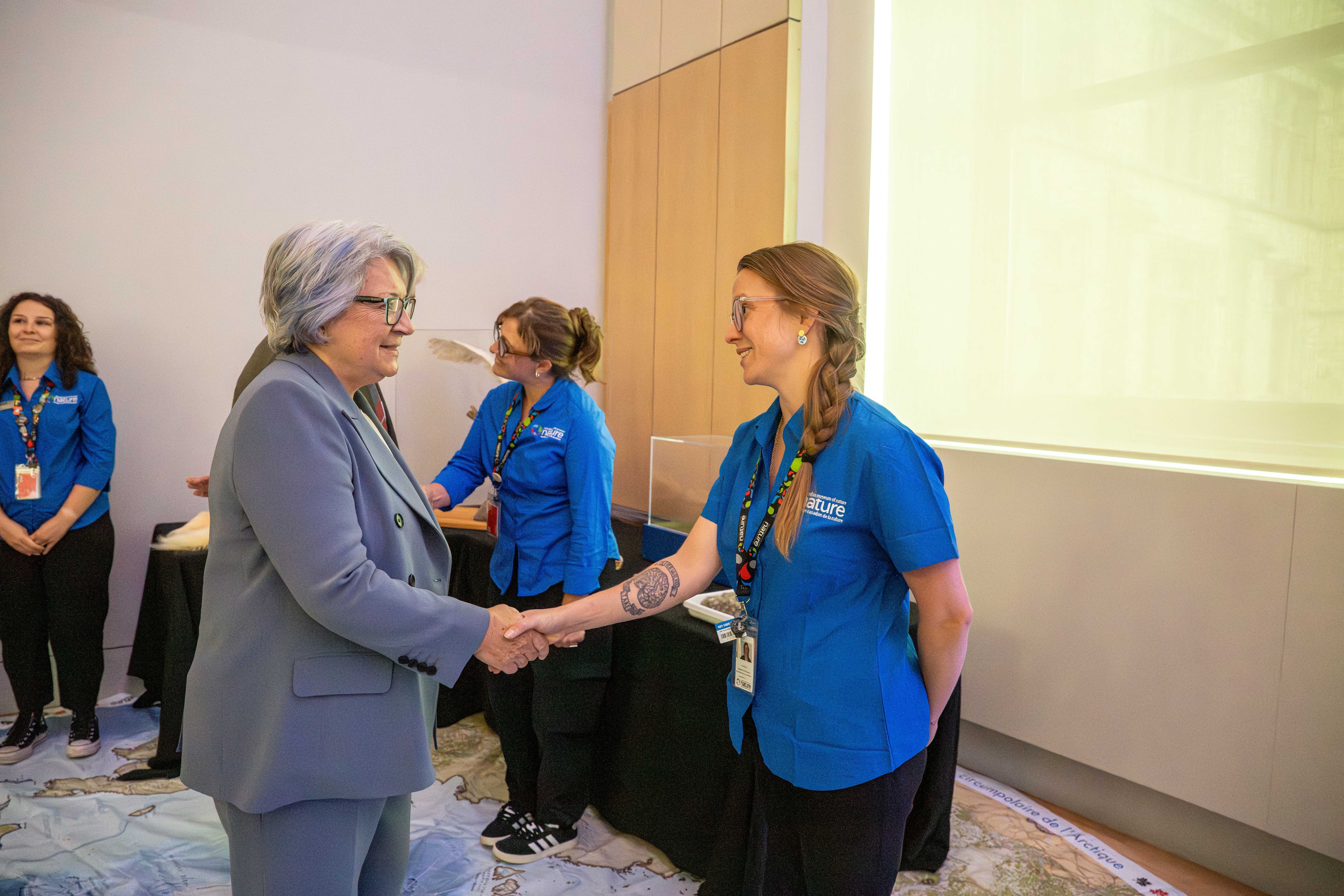 Governor General Mary Simon shaking hands with staff from the Nature Museum.