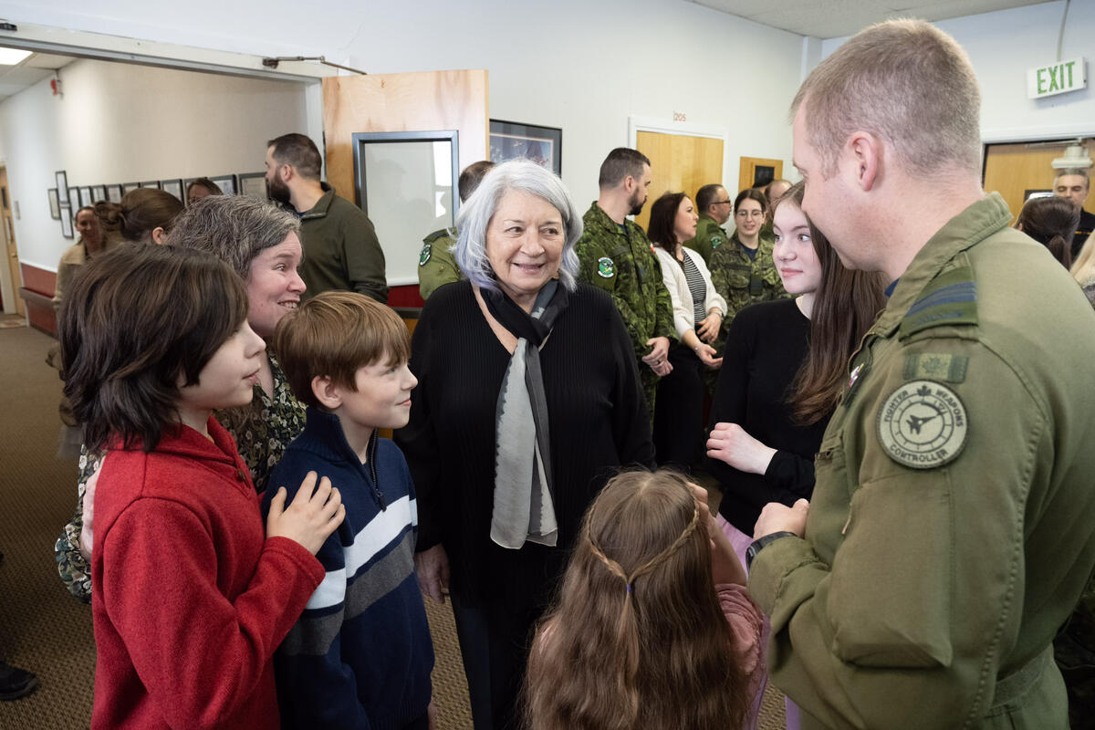 Governor General Mary Simon speaks to a Canadian Armed Forces members and his families