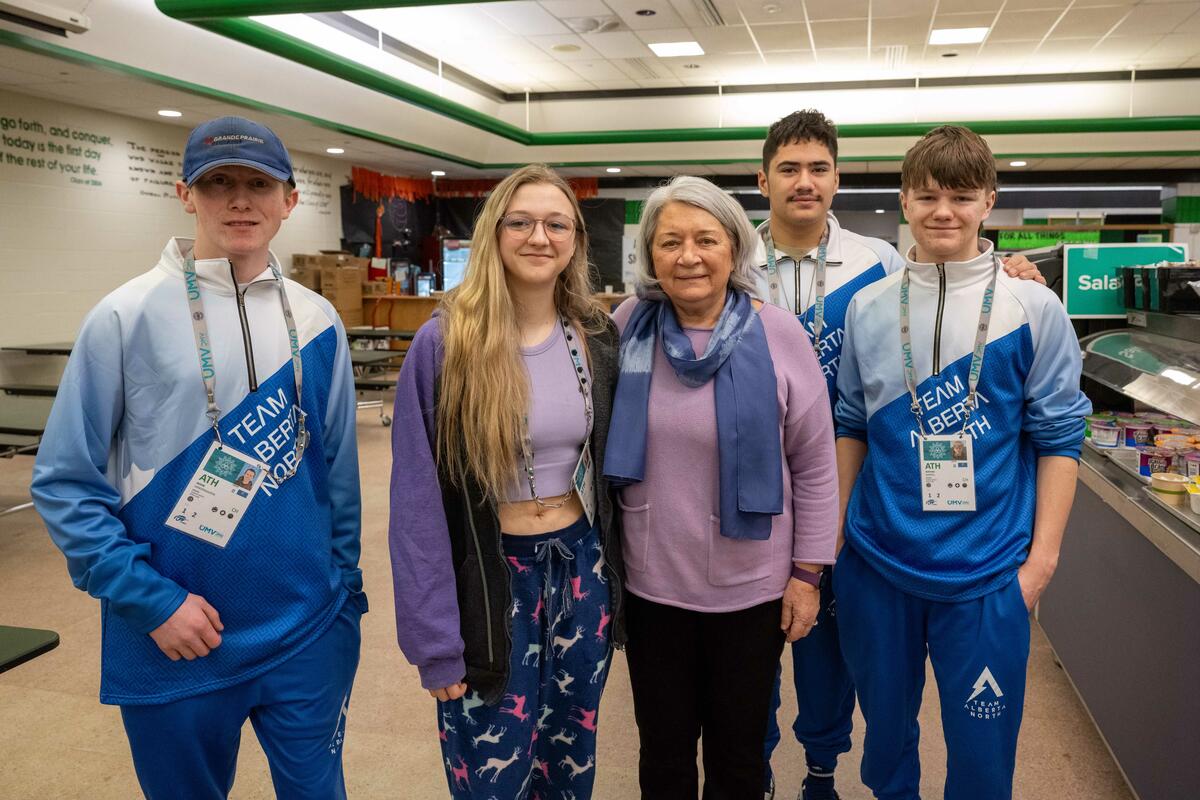 Governor General Mary Simon poses with athletes